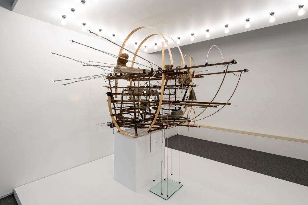 <Only the Turtle Does Not Know Our Weekends>, 2024, Wood, Motor, Light bulb, Thread, Mixed media, 120x180x300cm